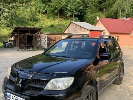 Міцубісі Аутлендер 2005 у Рахове на Automoto.ua Чорний Міцубісі Аутлендер, об'ємом двигуна 2 л та пробігом 200 тис. км за 7000 $, фото 1 на Automoto.ua