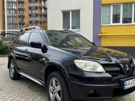 Черный Мицубиси Аутлендер, объемом двигателя 2.38 л и пробегом 270 тыс. км за 5900 $, фото 1 на Automoto.ua