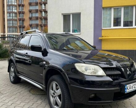 Черный Мицубиси Аутлендер, объемом двигателя 2.38 л и пробегом 270 тыс. км за 5900 $, фото 1 на Automoto.ua