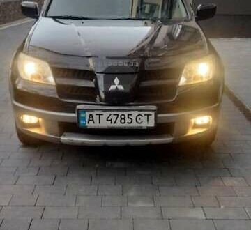 Черный Мицубиси Аутлендер, объемом двигателя 2 л и пробегом 380 тыс. км за 5000 $, фото 1 на Automoto.ua