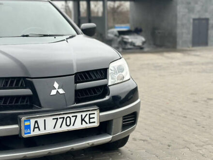 Чорний Міцубісі Аутлендер, об'ємом двигуна 2 л та пробігом 297 тис. км за 6200 $, фото 1 на Automoto.ua
