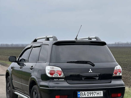 Черный Мицубиси Аутлендер, объемом двигателя 2 л и пробегом 230 тыс. км за 6300 $, фото 1 на Automoto.ua