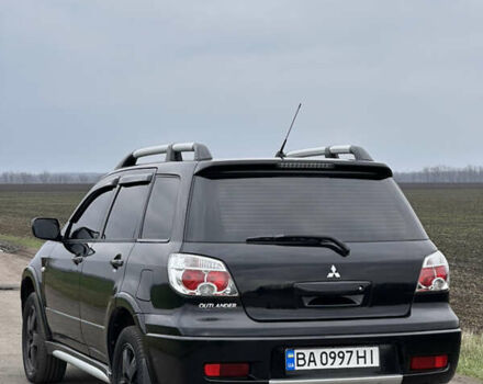 Чорний Міцубісі Аутлендер, об'ємом двигуна 2 л та пробігом 230 тис. км за 6300 $, фото 1 на Automoto.ua