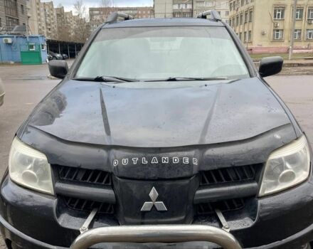 Черный Мицубиси Аутлендер, объемом двигателя 2 л и пробегом 300 тыс. км за 4600 $, фото 1 на Automoto.ua