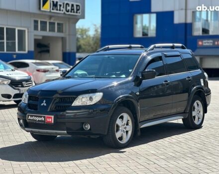 Чорний Міцубісі Аутлендер, об'ємом двигуна 2.4 л та пробігом 252 тис. км за 6990 $, фото 1 на Automoto.ua