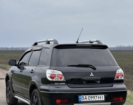 Чорний Міцубісі Аутлендер, об'ємом двигуна 2 л та пробігом 230 тис. км за 6300 $, фото 1 на Automoto.ua
