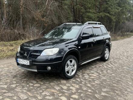 Черный Мицубиси Аутлендер, объемом двигателя 2.4 л и пробегом 310 тыс. км за 5300 $, фото 1 на Automoto.ua