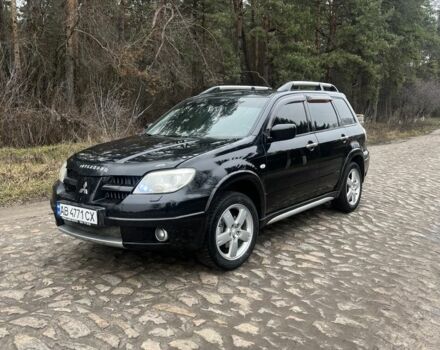 Черный Мицубиси Аутлендер, объемом двигателя 2.4 л и пробегом 310 тыс. км за 5300 $, фото 1 на Automoto.ua
