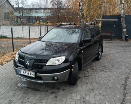 Черный Мицубиси Аутлендер, объемом двигателя 2 л и пробегом 260 тыс. км за 5400 $, фото 1 на Automoto.ua