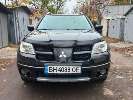Черный Мицубиси Аутлендер, объемом двигателя 2.4 л и пробегом 256 тыс. км за 6900 $, фото 1 на Automoto.ua