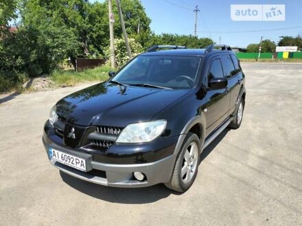 Мицубиси Аутлендер 2006 в Белой Церкве на Automoto.ua Черный Мицубиси Аутлендер, объемом двигателя 2 л и пробегом 187 тыс. км за 6400 $, фото 1 на Automoto.ua