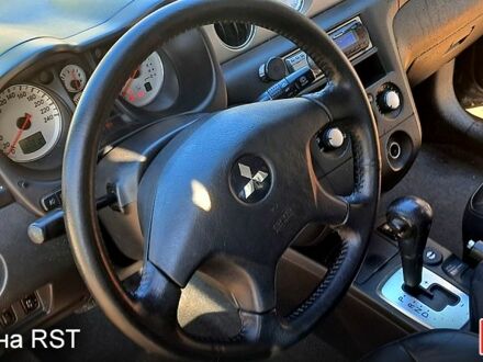 Черный Мицубиси Аутлендер, объемом двигателя 2.4 л и пробегом 185 тыс. км за 7500 $, фото 1 на Automoto.ua