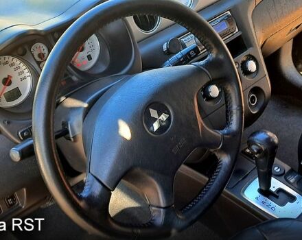 Чорний Міцубісі Аутлендер, об'ємом двигуна 2.4 л та пробігом 185 тис. км за 7500 $, фото 1 на Automoto.ua