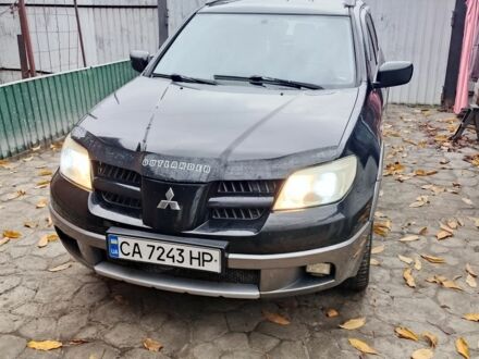Чорний Міцубісі Аутлендер, об'ємом двигуна 2.4 л та пробігом 280 тис. км за 5700 $, фото 1 на Automoto.ua
