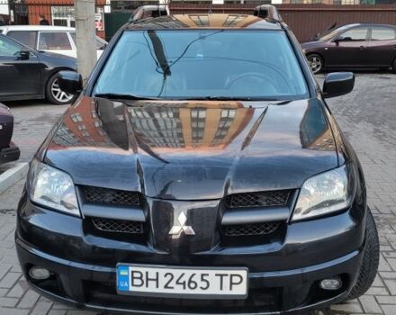 Чорний Міцубісі Аутлендер, об'ємом двигуна 2.4 л та пробігом 265 тис. км за 6200 $, фото 1 на Automoto.ua