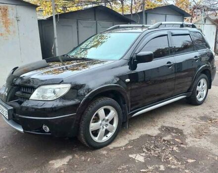 Черный Мицубиси Аутлендер, объемом двигателя 2.4 л и пробегом 256 тыс. км за 6900 $, фото 1 на Automoto.ua
