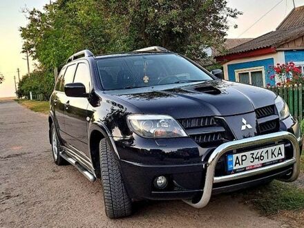 Мицубиси Аутлендер 2006 в Подольск (Котовск) на Automoto.ua Черный Мицубиси Аутлендер, объемом двигателя 2 л и пробегом 170 тыс. км за 9000 $, фото 1 на Automoto.ua