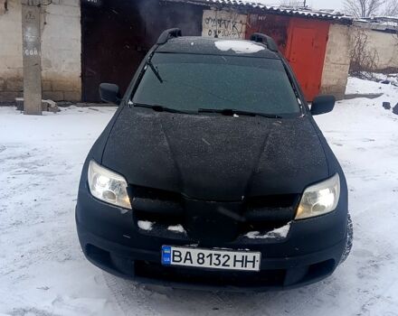 Черный Мицубиси Аутлендер, объемом двигателя 2 л и пробегом 26000 тыс. км за 4500 $, фото 1 на Automoto.ua