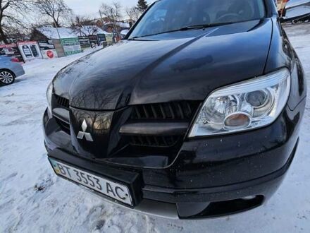 Чорний Міцубісі Аутлендер, об'ємом двигуна 2 л та пробігом 326 тис. км за 9000 $, фото 1 на Automoto.ua