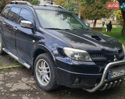 Чорний Міцубісі Аутлендер, об'ємом двигуна 2 л та пробігом 219 тис. км за 5950 $, фото 1 на Automoto.ua