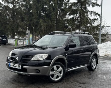 Черный Мицубиси Аутлендер, объемом двигателя 2.4 л и пробегом 200 тыс. км за 4699 $, фото 1 на Automoto.ua