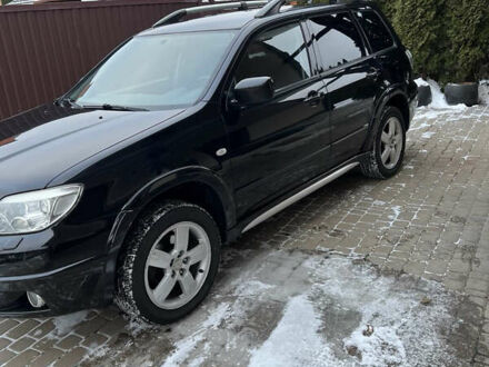 Чорний Міцубісі Аутлендер, об'ємом двигуна 2.4 л та пробігом 165 тис. км за 6800 $, фото 1 на Automoto.ua