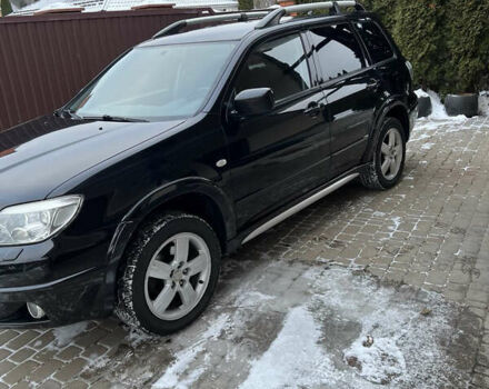 Чорний Міцубісі Аутлендер, об'ємом двигуна 2.4 л та пробігом 165 тис. км за 6800 $, фото 1 на Automoto.ua