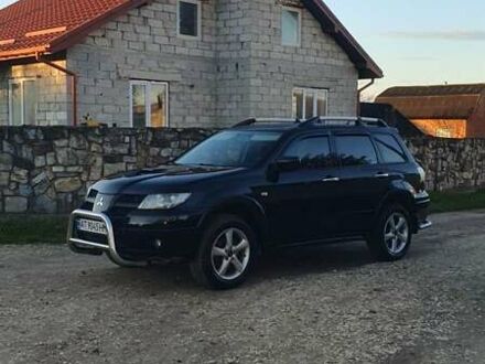 Чорний Міцубісі Аутлендер, об'ємом двигуна 2 л та пробігом 263 тис. км за 7250 $, фото 1 на Automoto.ua