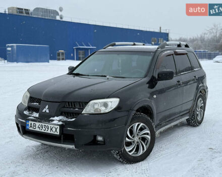 Чорний Міцубісі Аутлендер, об'ємом двигуна 2.4 л та пробігом 333 тис. км за 5750 $, фото 1 на Automoto.ua