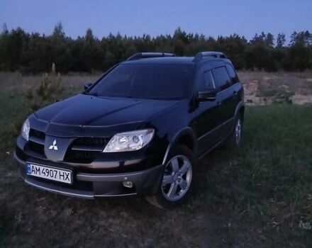 Черный Мицубиси Аутлендер, объемом двигателя 2 л и пробегом 230 тыс. км за 7200 $, фото 1 на Automoto.ua