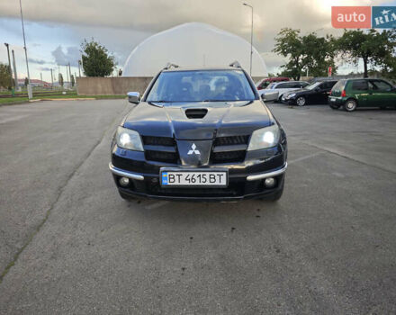 Черный Мицубиси Аутлендер, объемом двигателя 2 л и пробегом 207 тыс. км за 6900 $, фото 1 на Automoto.ua