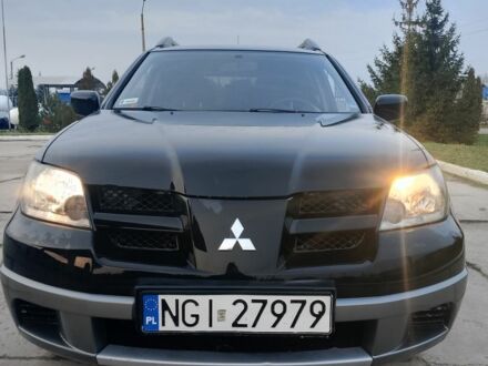 Черный Мицубиси Аутлендер, объемом двигателя 2 л и пробегом 169 тыс. км за 3500 $, фото 1 на Automoto.ua
