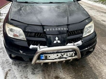 Черный Мицубиси Аутлендер, объемом двигателя 2 л и пробегом 300 тыс. км за 4600 $, фото 1 на Automoto.ua