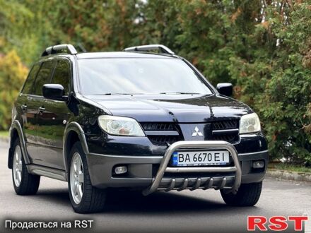 Чорний Міцубісі Аутлендер, об'ємом двигуна 2.4 л та пробігом 263 тис. км за 5999 $, фото 1 на Automoto.ua