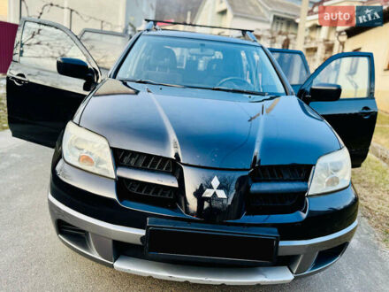 Мицубиси Аутлендер 2006 в Тячеве на Automoto.ua Черный Мицубиси Аутлендер, объемом двигателя 2 л и пробегом 210 тыс. км за 5550 $, фото 1 на Automoto.ua
