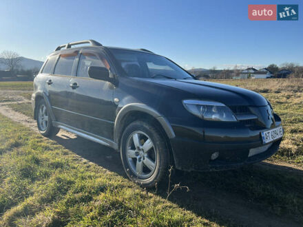 Черный Мицубиси Аутлендер, объемом двигателя 2.38 л и пробегом 230 тыс. км за 5350 $, фото 1 на Automoto.ua