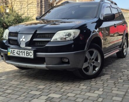 Черный Мицубиси Аутлендер, объемом двигателя 2.4 л и пробегом 260 тыс. км за 7500 $, фото 1 на Automoto.ua