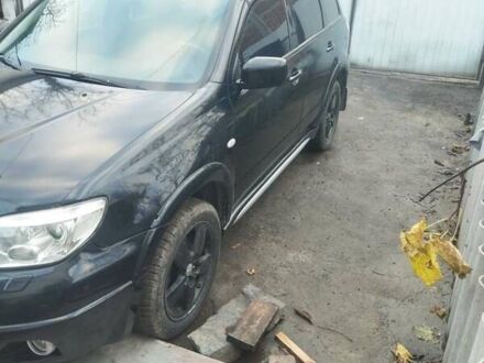 Черный Мицубиси Аутлендер, объемом двигателя 2.4 л и пробегом 280 тыс. км за 5455 $, фото 1 на Automoto.ua