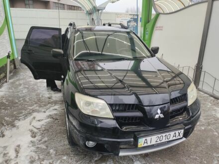 Чорний Міцубісі Аутлендер, об'ємом двигуна 2.4 л та пробігом 360 тис. км за 5200 $, фото 1 на Automoto.ua