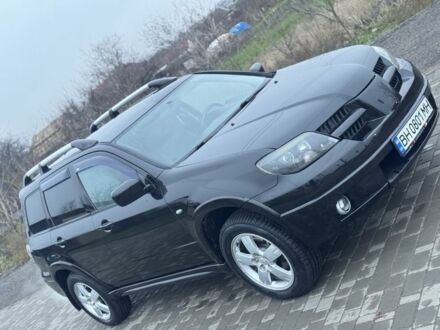 Чорний Міцубісі Аутлендер, об'ємом двигуна 2.4 л та пробігом 202 тис. км за 5800 $, фото 1 на Automoto.ua