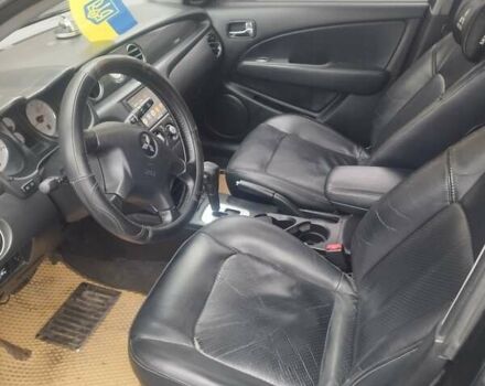 Черный Мицубиси Аутлендер, объемом двигателя 2.38 л и пробегом 260 тыс. км за 6000 $, фото 1 на Automoto.ua