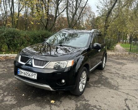 Черный Мицубиси Аутлендер, объемом двигателя 2.4 л и пробегом 230 тыс. км за 8500 $, фото 1 на Automoto.ua