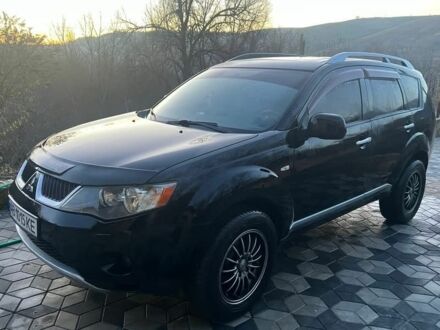Черный Мицубиси Аутлендер, объемом двигателя 2 л и пробегом 288 тыс. км за 9200 $, фото 1 на Automoto.ua