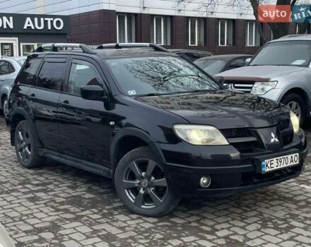 Черный Мицубиси Аутлендер, объемом двигателя 2.4 л и пробегом 186 тыс. км за 5700 $, фото 1 на Automoto.ua