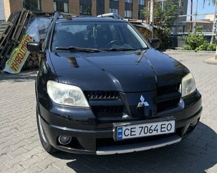 Черный Мицубиси Аутлендер, объемом двигателя 2 л и пробегом 238 тыс. км за 5700 $, фото 1 на Automoto.ua