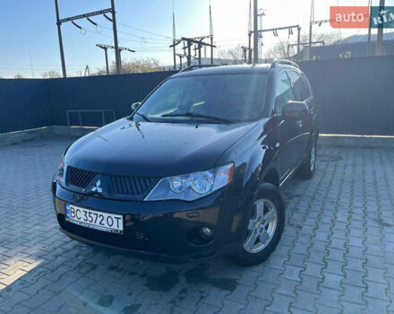 Чорний Міцубісі Аутлендер, об'ємом двигуна 2 л та пробігом 330 тис. км за 7500 $, фото 1 на Automoto.ua