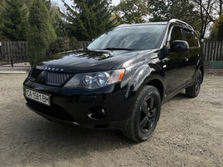 Черный Мицубиси Аутлендер, объемом двигателя 3 л и пробегом 139 тыс. км за 9800 $, фото 1 на Automoto.ua