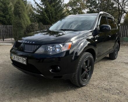 Черный Мицубиси Аутлендер, объемом двигателя 3 л и пробегом 139 тыс. км за 9800 $, фото 1 на Automoto.ua