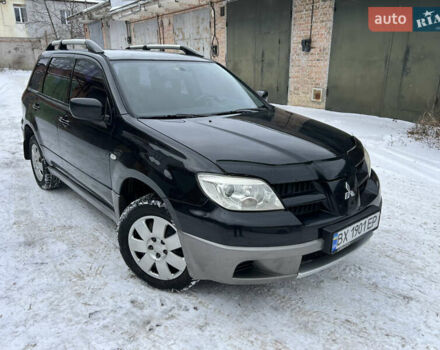 Черный Мицубиси Аутлендер, объемом двигателя 2 л и пробегом 276 тыс. км за 5599 $, фото 1 на Automoto.ua