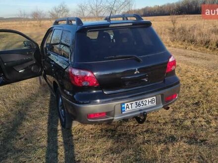 Мицубиси Аутлендер 2007 в Черновцах на Automoto.ua Черный Мицубиси Аутлендер, объемом двигателя 2 л и пробегом 220 тыс. км за 6000 $, фото 1 на Automoto.ua